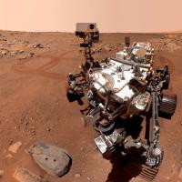 		View from Mars: red landscape and robot
	