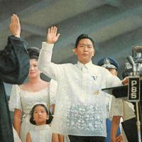 		Person at a podium, hand raised to take an oath
	