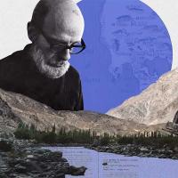		Composit image of a man wearing glasses, a purple moon, a mountain, and a metal monument
	