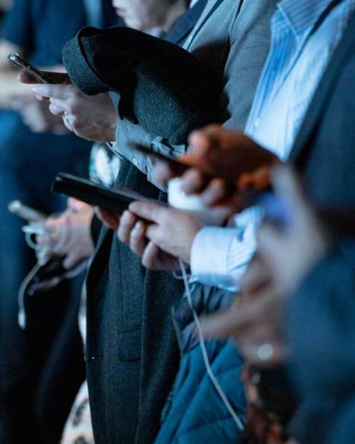 		people in business clothes check smart phones
	