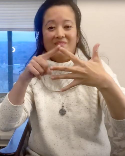 		ASL professor Matilda Prestano performing sign language
	