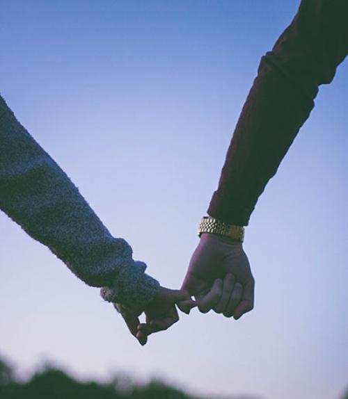 		 Two people holding hands
	