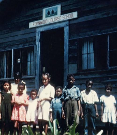 		 African American children standing in front of the &amp;quot;Fernwood Colored School&amp;quot;
	
