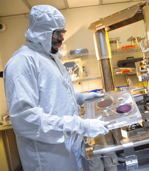 A man wearing protective gear in a lab
