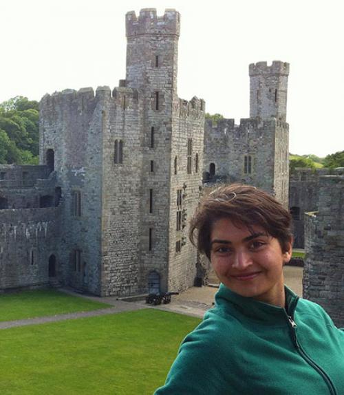 		 Cornell student in front of a castle
	