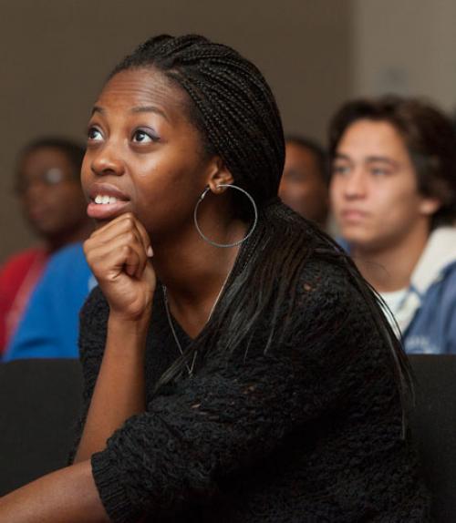 		 Female Black student listening to talk
	