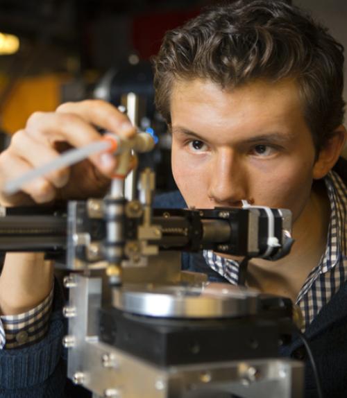 		 Undergraduate student using scientific instrument
	