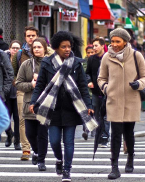 		 Students walking on city street
	