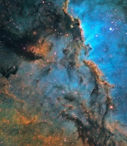 		 A cosmic scene of clouds and stars
	