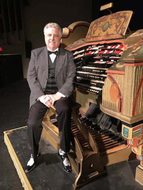  Organist sitting on organ bench