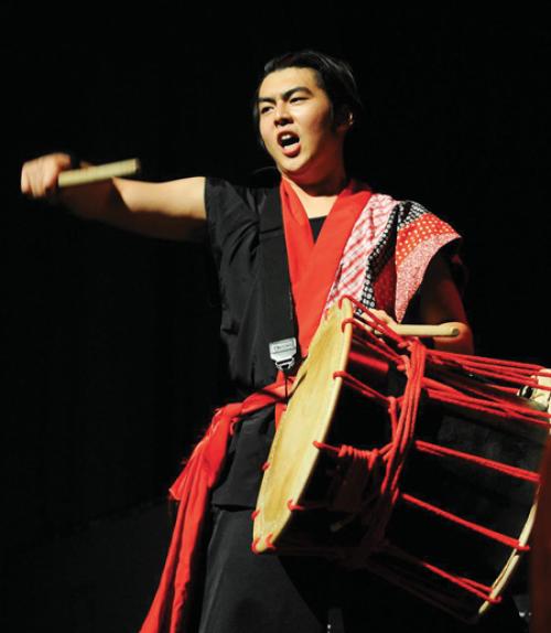 		 Leo Ikenaga playing taiko drum
	
