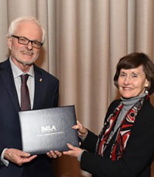  MLA President Anne Ruggles Gere presenting award to William Kennedy. Photo credit: Edward Savaria, Jr