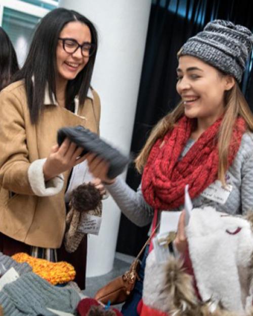 		Warm hats being shared with new Puerto Rican students
	