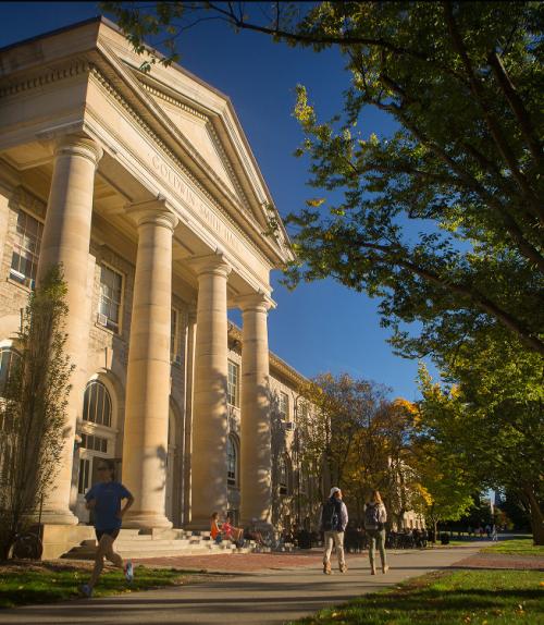		 Students walk past Goldwin Smith Hall in the fall
	