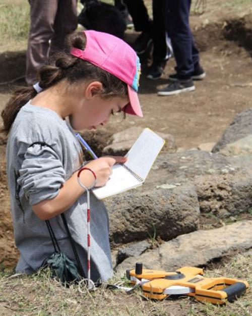 		Camper Mary draws an excavation trench at Gegharot, an archaeological site in Armenia.
	