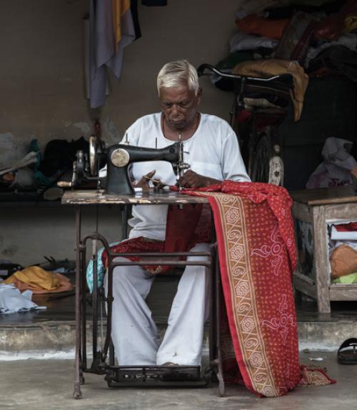 		 A woman sewing in India
	