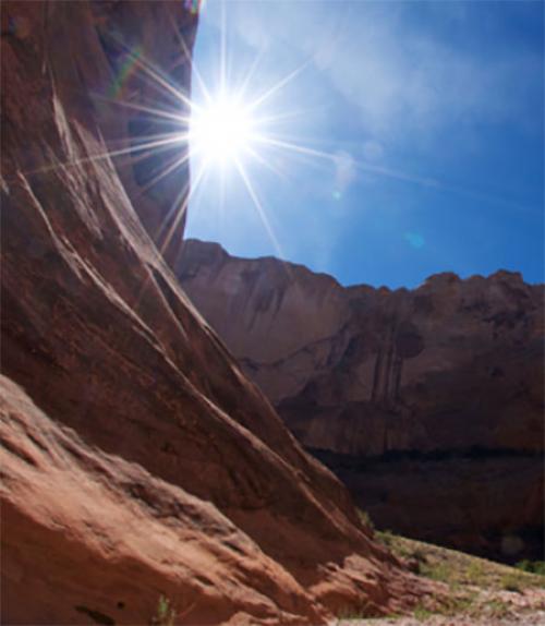 		 Image of a canyon in Utah with the sun shining down
	