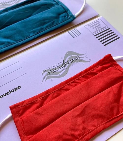 		 Mail in ballot envelop and face masks
	