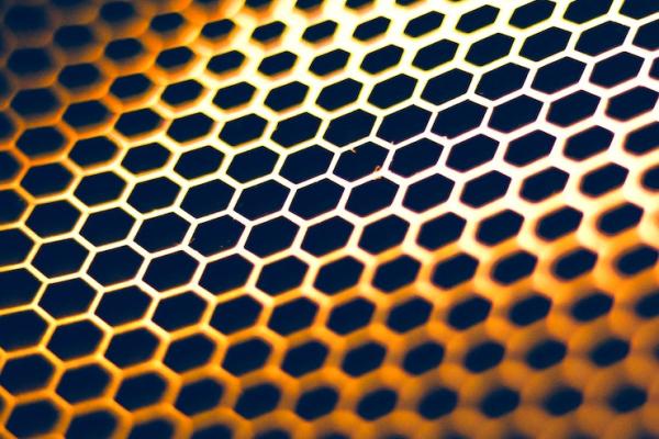 Golden honeycomb pattern over black