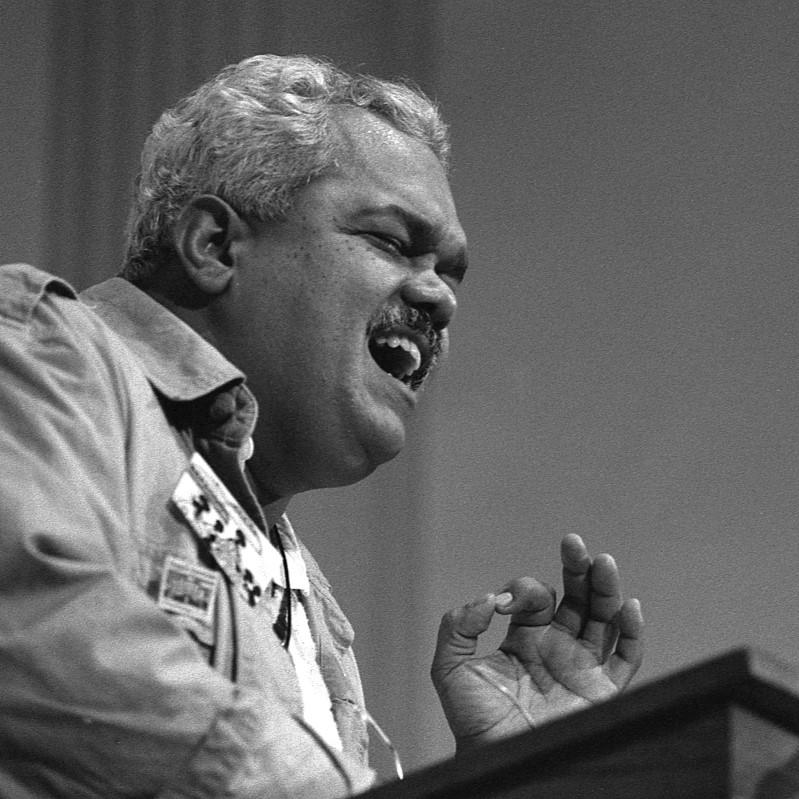 Person speaking passionately into a microphone