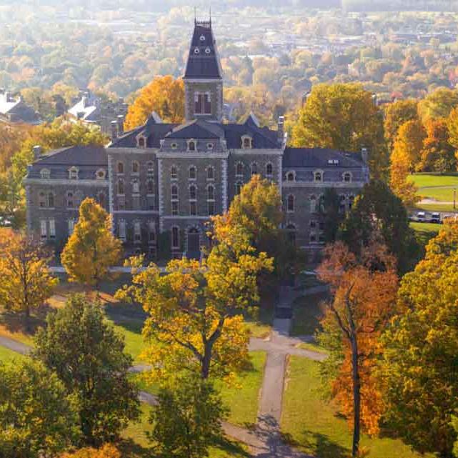 old building with fall leaves