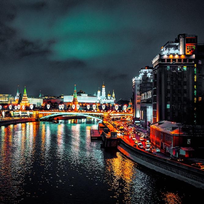 city lights on a river at night