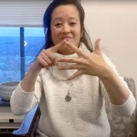 ASL professor Matilda Prestano performing sign language