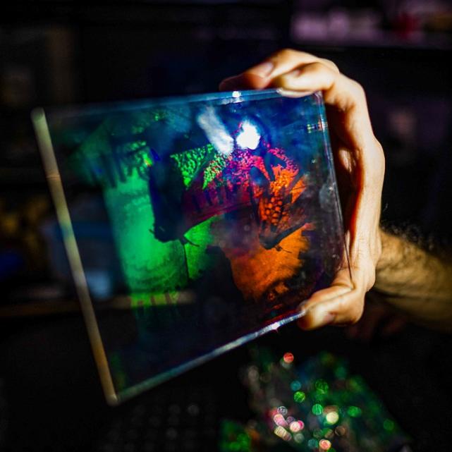 Hand holding a colorful rectangle