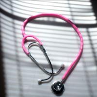 		doctor's stethoscope with a pink cord
	