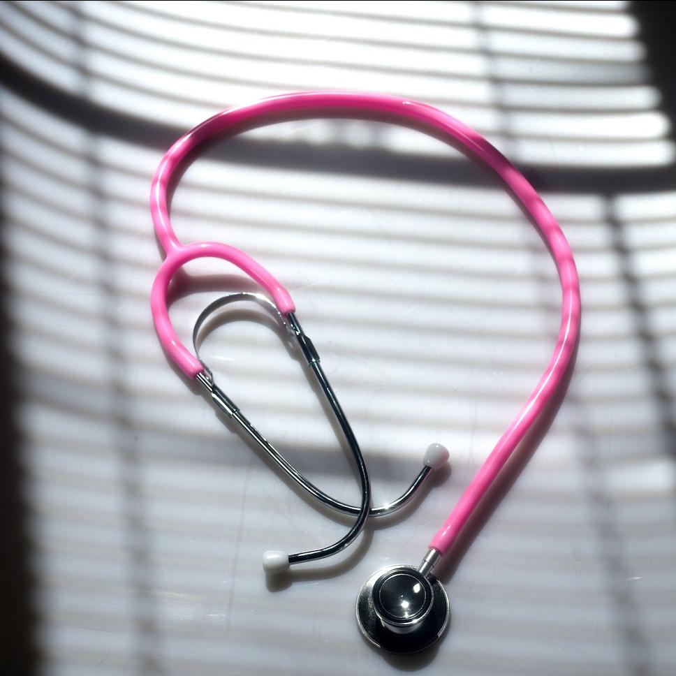 doctor's stethoscope with a pink cord