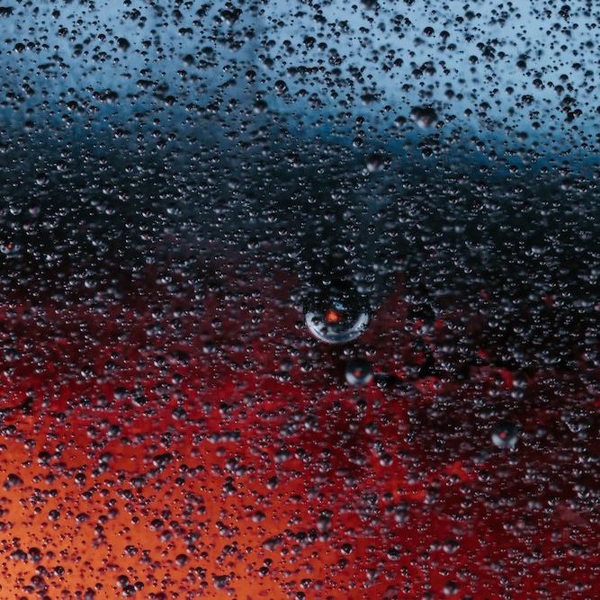 thousands of spherical particles shimmer against a dark background