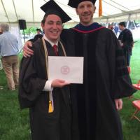 two people in graduation gowns