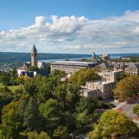 View of Cornell campus from above; under a blue sky