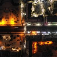 City blocks lit up at night, seen from far above