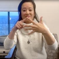 ASL professor Matilda Prestano performing sign language