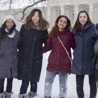 Five women standing in the snow