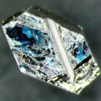 Hexagonal chip of uranium ruthenium silicide (URu2Si2)