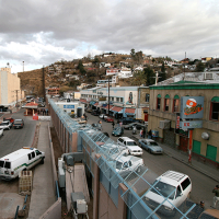  Border wall with vans and buildings