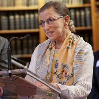 Ruth Bader Ginsburg, speaking at a podium