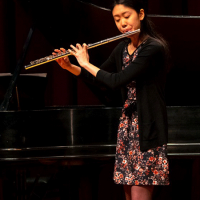 Joy Zhang playing the flute