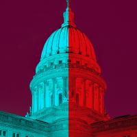  The top of the U.S. Capitol building, half in blue and half in red