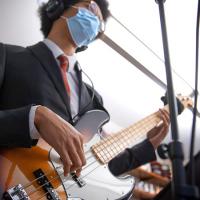  Close up of a hand playing an electric bass
