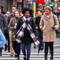 Students walking on city street