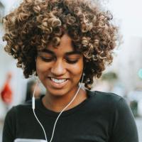 Woman listening to music on her iphone
