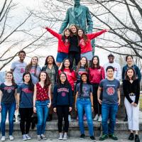 Student ambassadors standing in front of a statue of Andrew Dickson White