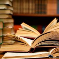 books lying open on a table