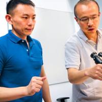 Xianwen Mao, left, and Peng Chen, the Peter J.W. Debye Professor of Chemistry, are pictured in the microscope room in Olin Research Laboratory.