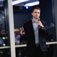 Student giving speech with microphone
