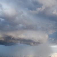 Dark clouds over a populated area