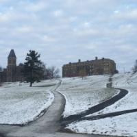 A snowy view up Libe Slope at McGraw Hall and Morrill Hall overlooking the Arts Quad.